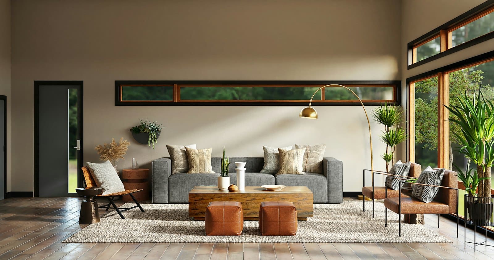 Modern living room with gray sofa, wooden coffee table, leather ottomans, and potted plants by large windows